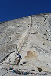 Back on solid ground in one piece. One tired guy waiting to ascend the cables remarked, "Hey look, they sent two guys down to carry us up!"