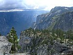 Above Yosemite Point, with some hikers posing cliffside