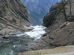 On the return trip, I climb down closer to the edge. In My First Summer in the Sierra, John Muir said he lowered himself down to a tiny platform directly above the dizzying drop, from which he wasn't sure he could get back up. He may have stood on the tiny ledge at right above the precipice