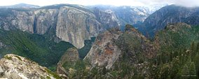 Dewey Point. In the foreground, the peaks of Cathedral Rocks. The small waterfall left of El Capitan is rarely seen from the valley because of the shape of the cove and tall trees. It's dry by mid-summer. 