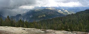 View east to Liberty Cap, Nevada Falls and Mt. Starr-King from Sentinel Dome as a storm rolls over east Yosemite Valley