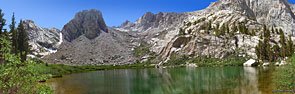 Emerald-colored Mirror Lake enclosed in a granite bowl