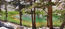 After a welcome respite in the cool shade of big trees around Mirror Lake, the trail climbs an exposed mound