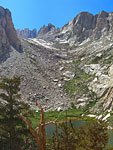 The serrated peaks of the Whitney ridge peek in