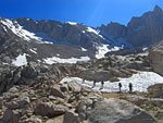 A weary group makes the final push through snow to Trail Camp