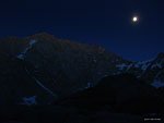 Full moon glow catches a ridge of Mt. Mallory above Consultation Lake