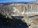 Smoke from a wildfire rises above ridges to the west 