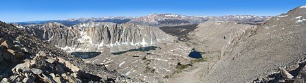 As the Whitney trail winds north around the final approach to the summit, more of the western Sierra comes into view. On it's way south from Yosemite to Mt. Whitney, the John Muir Trail skirts the banks of Guitar Lake (center right), the last lake on the trail. The neck of the guitar points through the gap to the Kaweah Range.