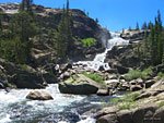 Looking back east to Tuolumne Falls from downstream. A videographer is setting up on a spot where I'd just stood.
