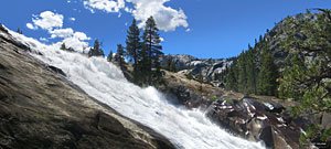 The river leaps over the cliff and slams down into submerged pits, creating more "water wheel" effects, then roars into a narrow channel.