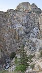 Through the valley, the highway hugs high cliffs with big dropoffs. Look closely to see the car and the road.