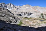 A morning view of the meadow basin north of Forester Pass. A trail crew is climbing up to go to work (bottom center)