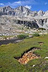 Unusual stone-filled hole, shaped like an arrow.