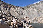 Above a bowl of impassibly high walls, Glen Pass is a small notch in the center of the ridge