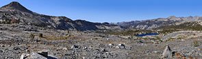 After many hours of climbing, the trail arrives at a rugged alpine plateau north of Red Peak. Gray Peak (L) and Red Devil Lake
