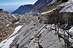 The Mt. Whitney Cables. The rocks left of the snow are actually building size boulders half a mile below.
