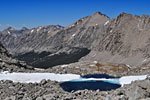 Icy blue tarn above treeline