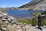 A JMT hiker looking south at Heart Lake