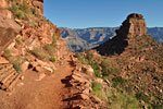Coming off the rim, the trail is steep switchbacks and slippery, then levels out crossing a plateau. O'Neill Butte at right and the North Rim beyond.