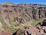 From a lookout point, a nice view of the bend where green Bright Angel canyon joins the Colorado River. This image with labels is in the Info section.