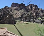 View south up the mountain just descended from the north shore of the South Kaibab bridge. You pass through a tunnel to get on it.