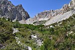 Once the high alpine comes into view, marked by a lively waterfall (center), the most difficult part of the climb - steep, rocky and exposed - begins.