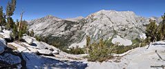 North across the deep valley to Cartridge Pass, entrance to the remote Lakes Basin region. Cartridge Pass was the original route of the John Muir Trail before construction of the Golden Staircase portion north of Mather Pass.
