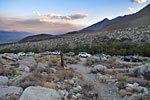 After 5+ miles over unsigned jagged rock roads into the remote desert, you're still unsure you made the right turn, when suddenly, a dozen cars.