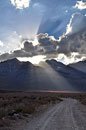 A welcoming beam of light directly on the trailhead promises an enjoyable trek