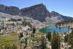 Moving west cross-country through Lake Basin, one comes across numerous lakes and a massive walls of stone