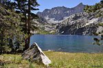 The tribute boulder overlooks an idyllic lakeside meadow
