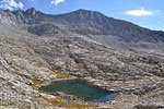 The tarn on the south slope of Cartridge Pass below 12,691 ft. Mt. Ruskin