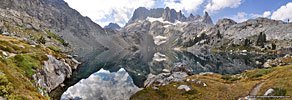 Iceberg Lake, where the trail ends, and the steep scramble up the loose scree (ctr L) to Cecile Lake begins
