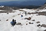 A pair of glissaders slide past us. Fun! But it has to be steeper for much of a thrill