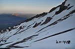 Day 3: After 3 hours of surreally quiet ice climbing in the pitch black predawn, our world slowly rotates in to the sun. Half a dozen groups are all climbing at the same time, some straight up, others zigzagging up like us