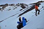 This pic shows a little bit of how steep this slope is. It's sheer ice, impossible without crampons. We have to chip sitting ledges out of the ice with our axes. One slip would send you hurtling thousands of feet down the slope