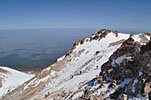 This northeast view shows a bit of the size of the summit. The east side is a looming dropoff