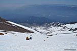 A pair of climbers glissading